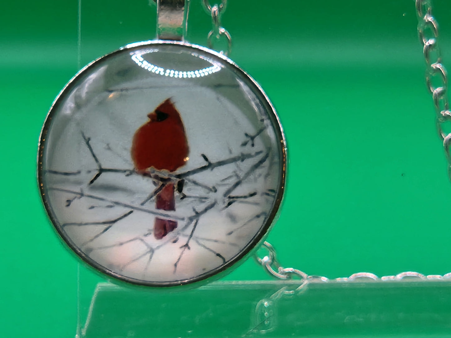 Red bird cardinal on branch in bubble pendant necklace