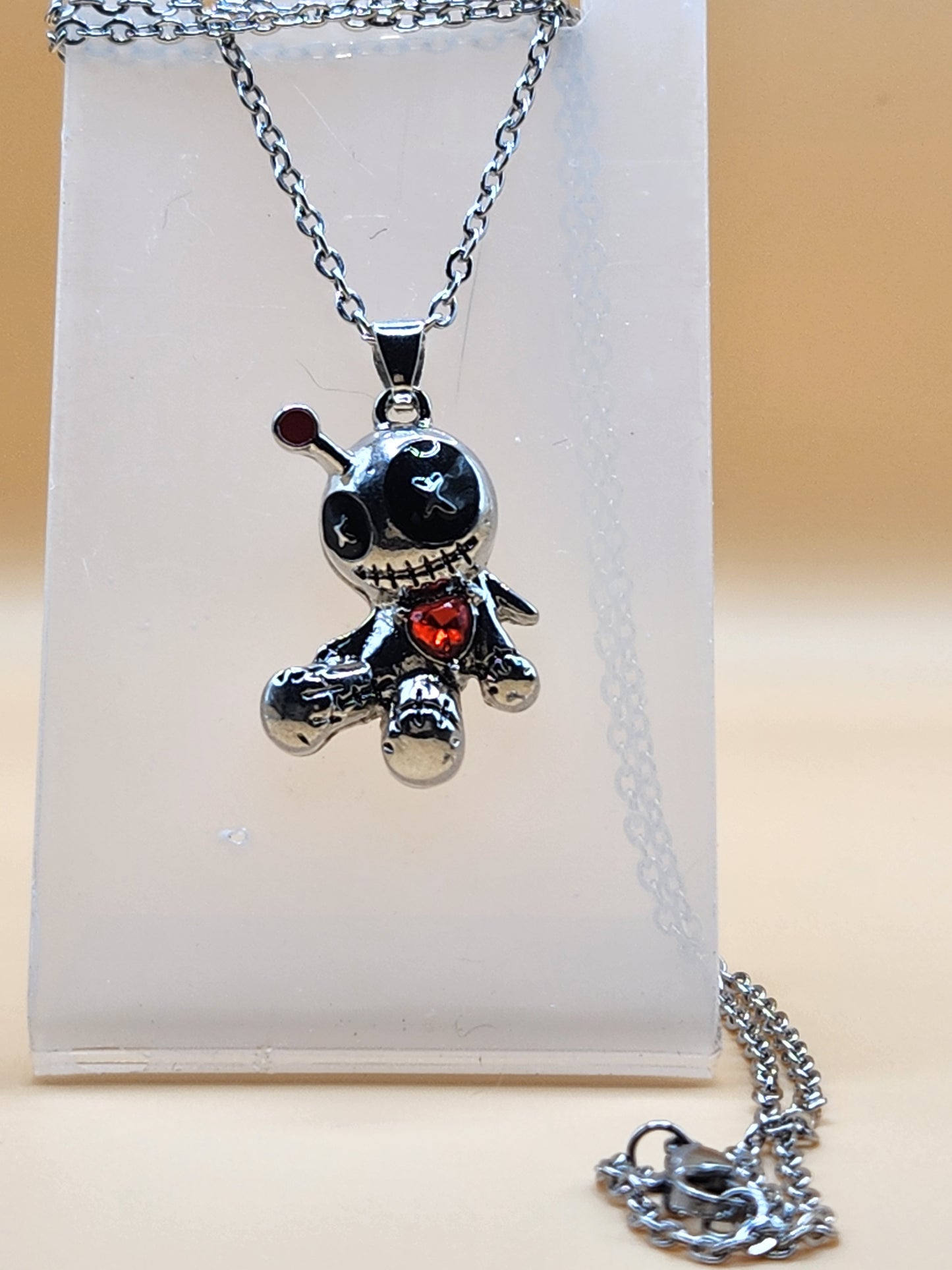 Voodoo doll necklace